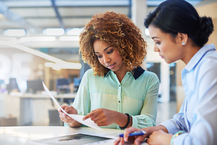 women reviewing a redundancy list